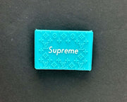 Blue Supreme grip with embossed Louis Vuitton pattern for stylish and functional use.
