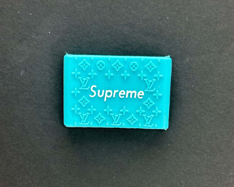 Blue Supreme grip with embossed Louis Vuitton pattern for stylish and functional use.