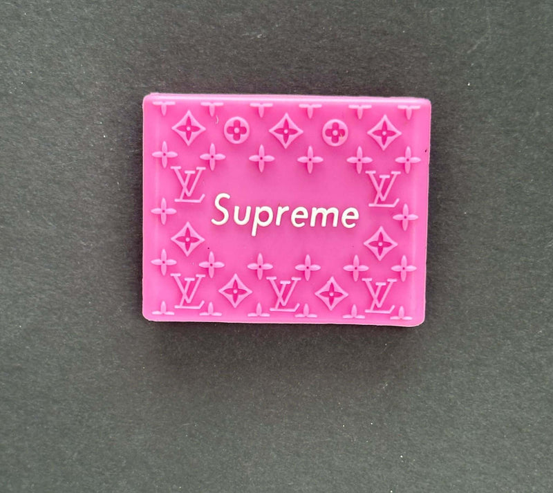 Supreme pink grip with Louis Vuitton pattern, perfect for stylish accessories and barbershop tools.
