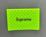 Green Supreme clipper grip featuring embossed Louis Vuitton patterns for enhanced control and precision in barbering.