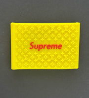 Yellow Supreme clipper grips featuring a branded design for enhanced barber precision and comfort.