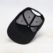 Black cap with mesh back on a white background