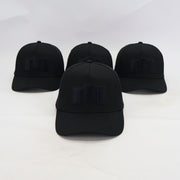 Four black baseball caps with a logo on a white background