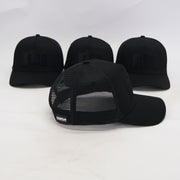 Four black baseball caps with a brand logo on a white background