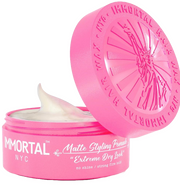 Immortal NYC pomades in a pink container, showcasing strong hold matte styling for an extreme dry look.