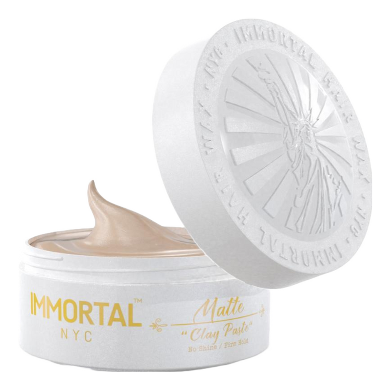 Immortal NYC pomades in a jar showcasing matte clay paste for strong hold and stylish hairstyles.