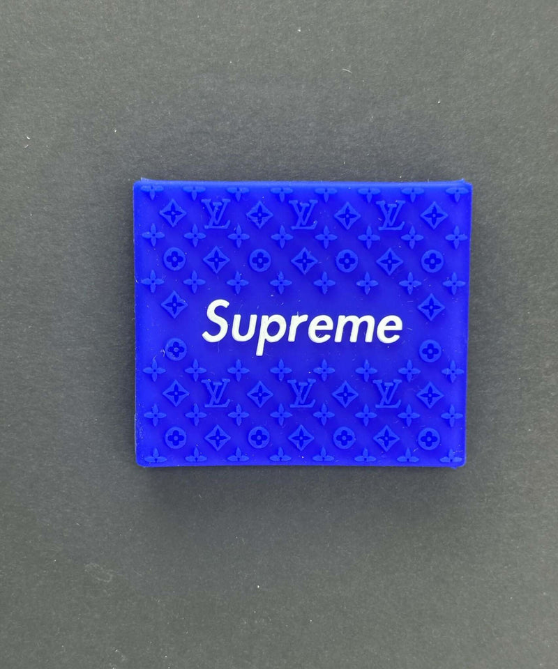 Blue Supreme grip with embossed Louis Vuitton pattern for stylish and functional use.