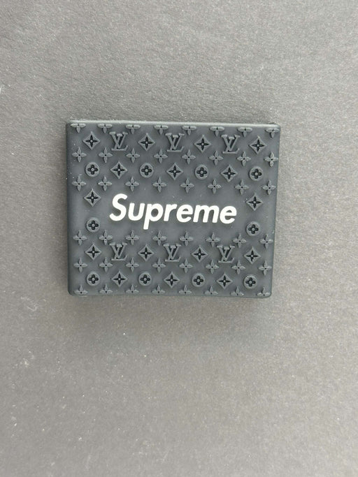 Supreme clipper grips featuring a black Louis Vuitton design for barbers, enhancing comfort and control.